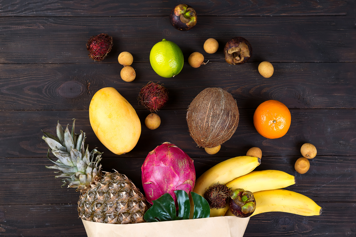 paper-bag-of-different-healthy-tropical-fruits-on-4R68JQV